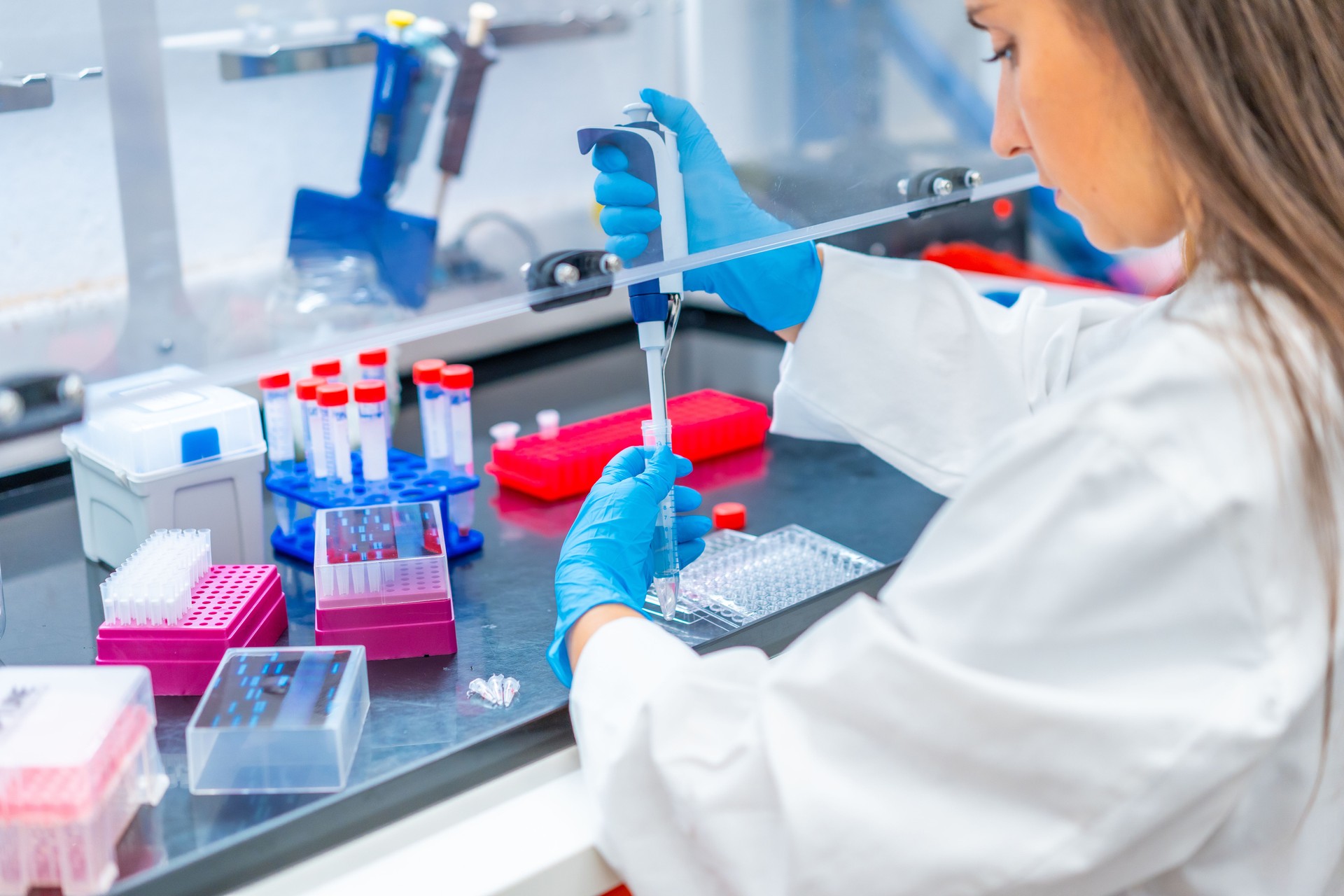 Woman pip petting cells in a laboratory