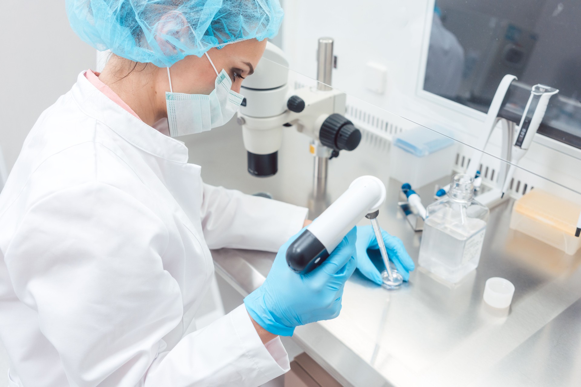 Scientist in lab conducting biotechnological experiment